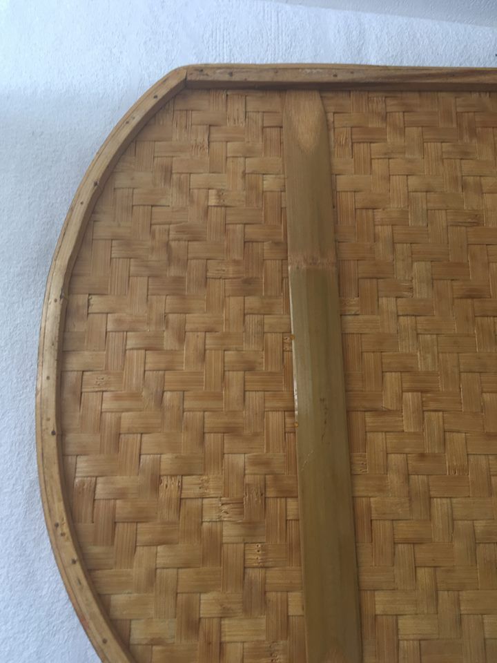 Two-tone braided bamboo tray and lacquered wood.