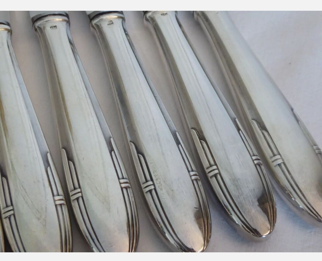 12 silver metal knives