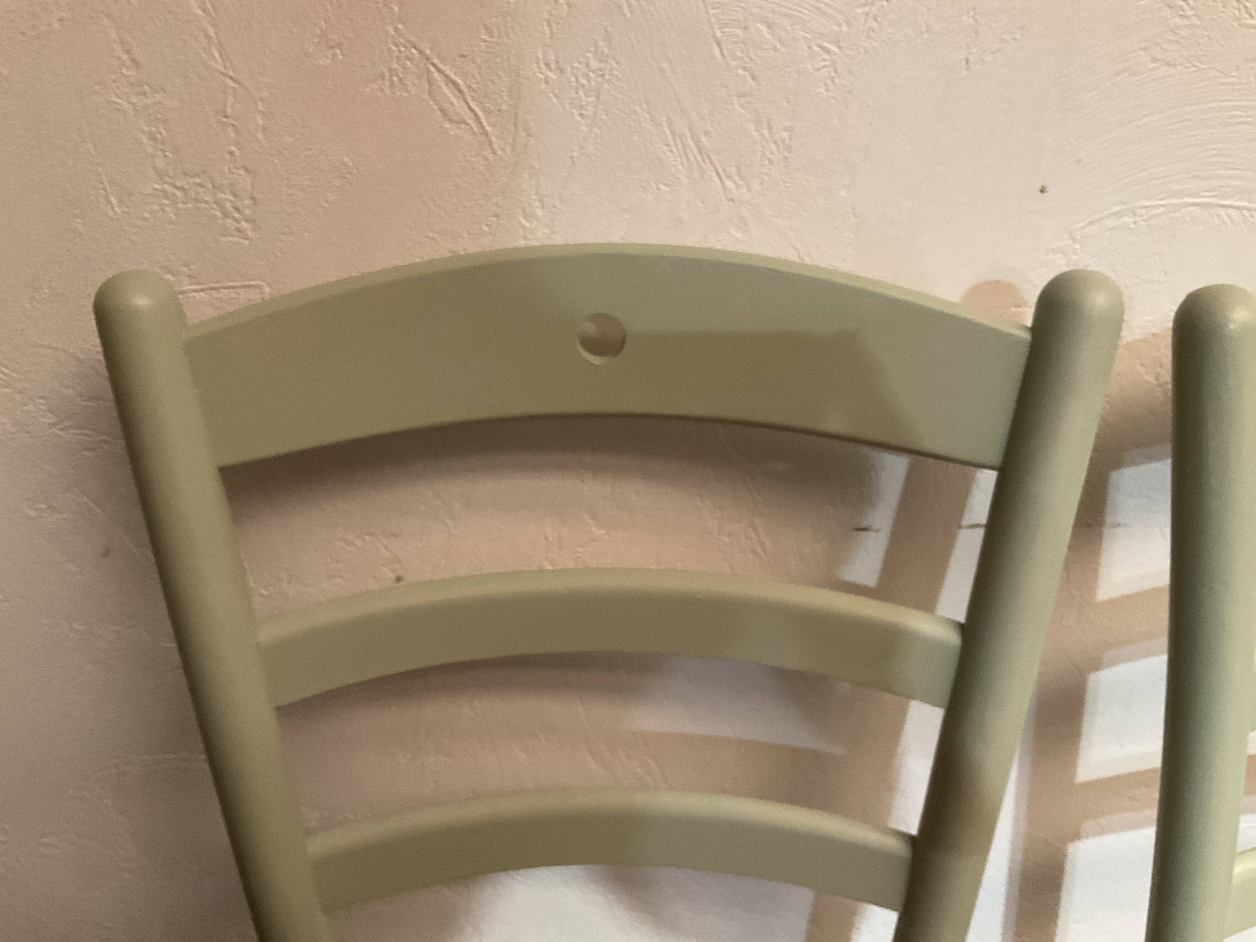 Pair of green straw sitting chairs