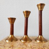 Set of three vintage wooden and brass candlesticks