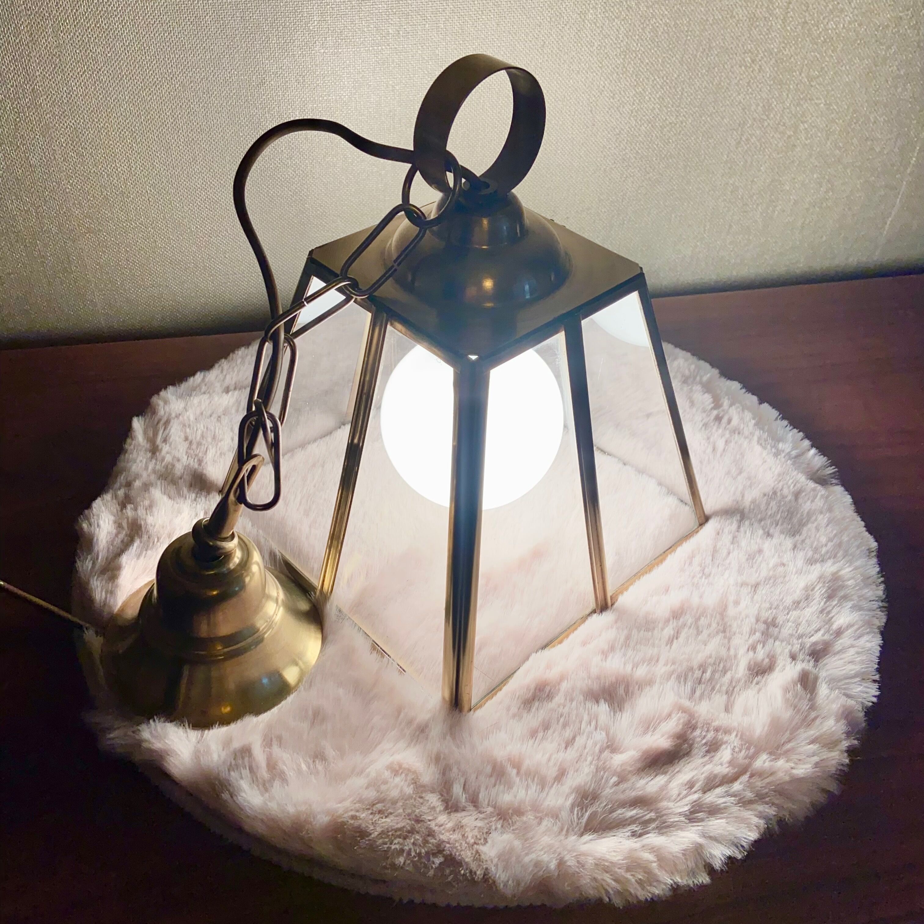 Glass and brass suspension