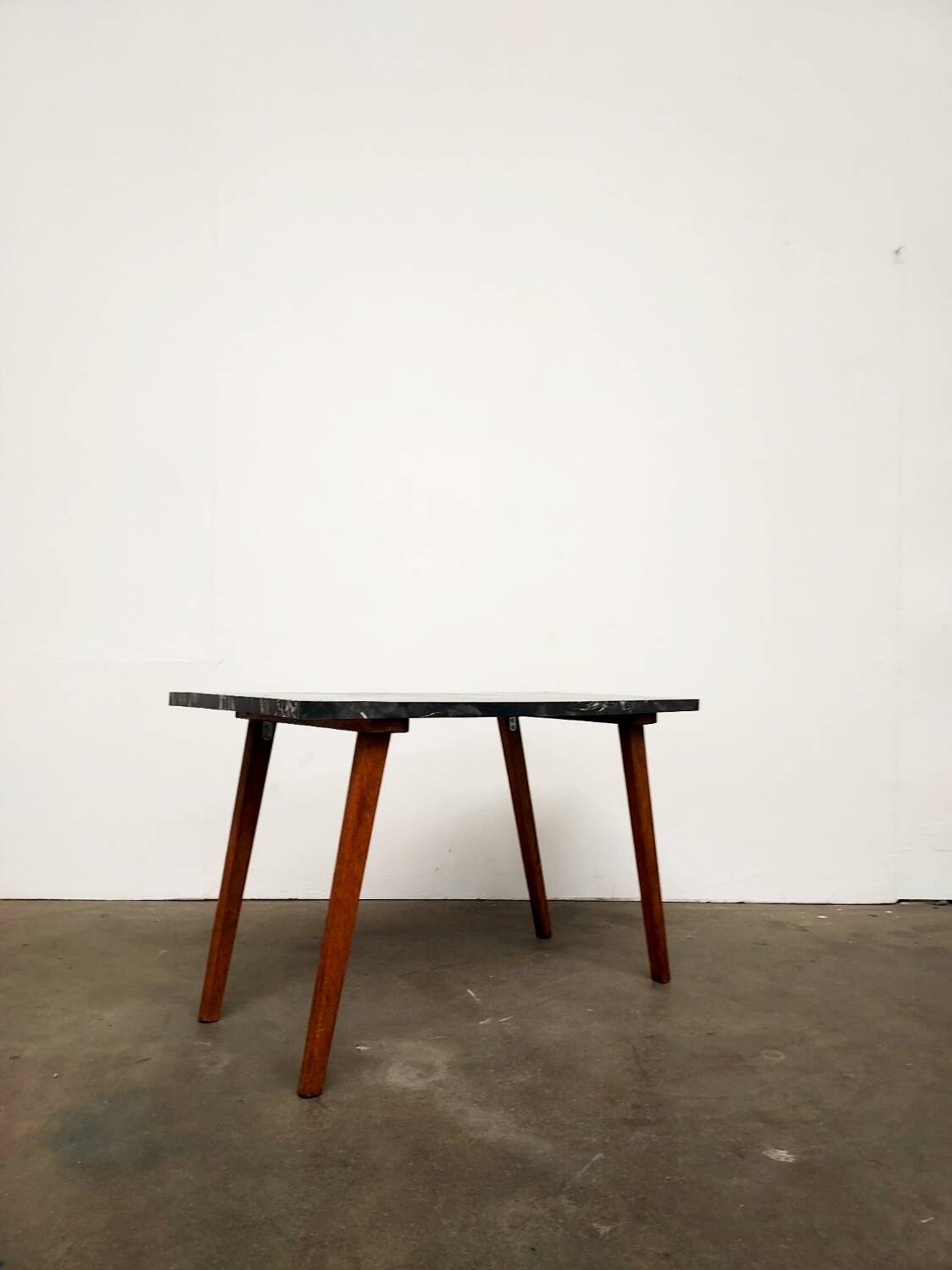 Marble effect Formica coffee table - flared legs