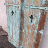 Pair of green wooden shutters