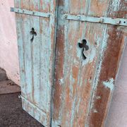 Pair of green wooden shutters