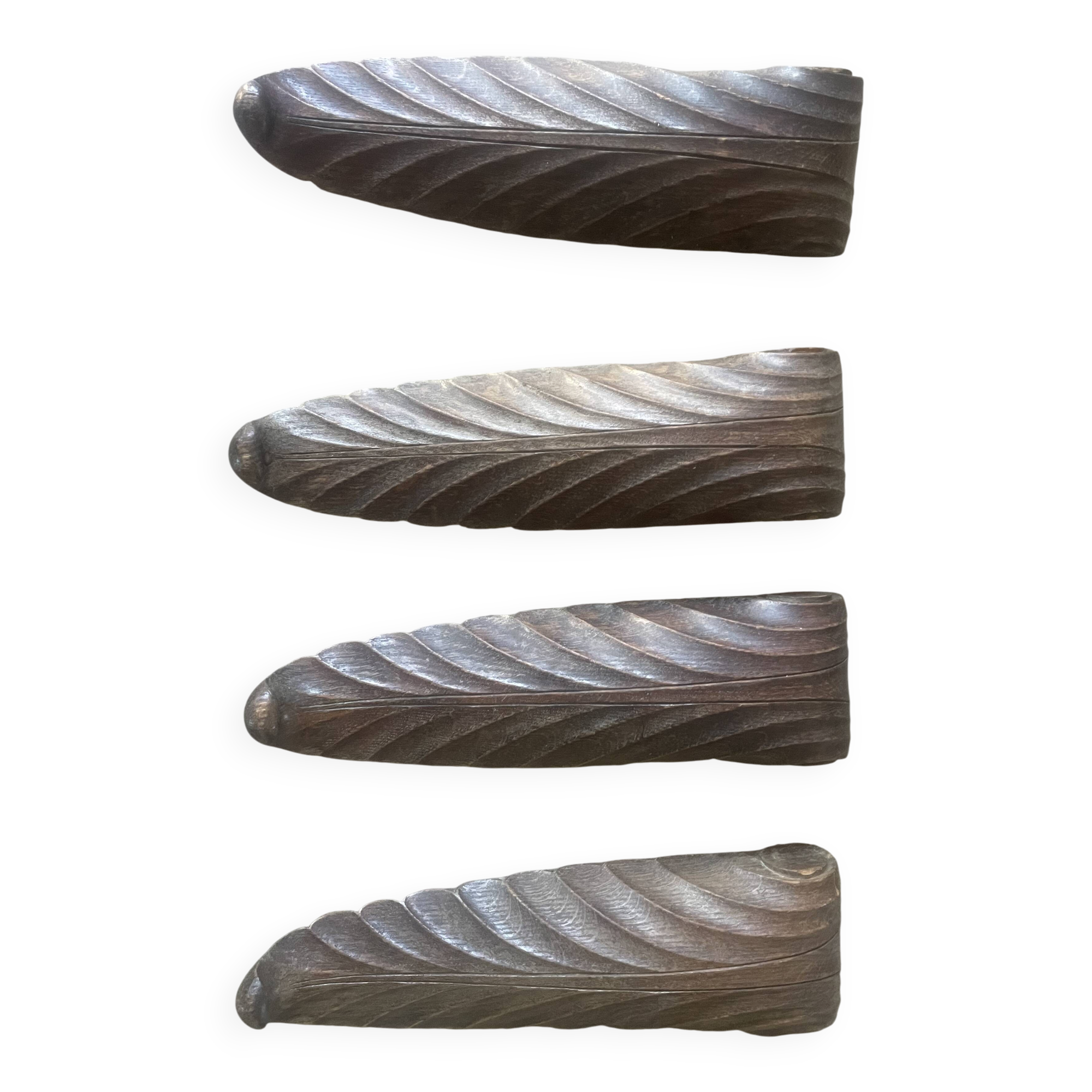 four decorative carved wooden objects