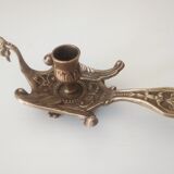 Old hand candlestick in chissed solid brass