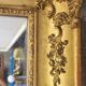 Antique Louis Philippe style gilded mirror decorated with floral motifs