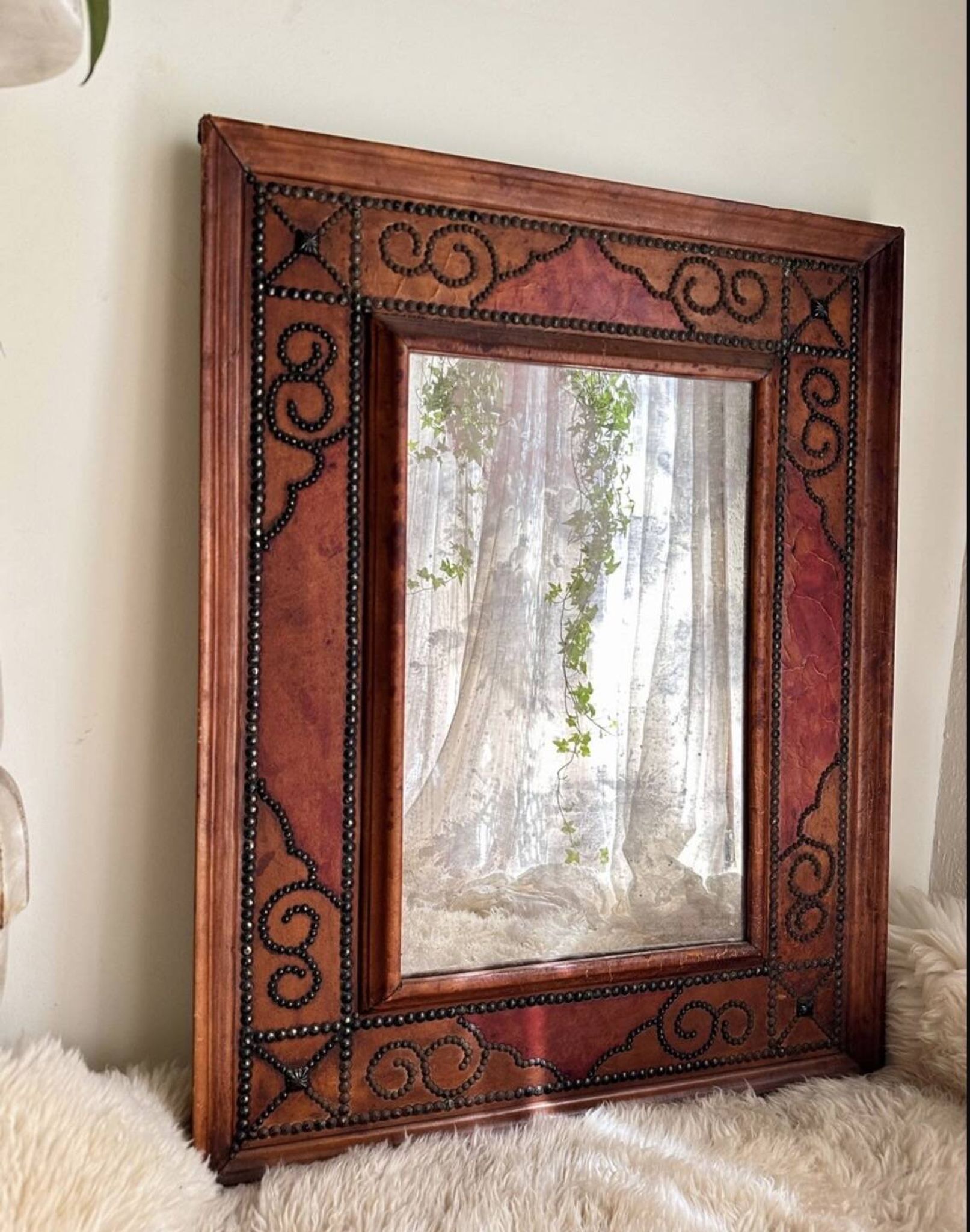Antique mirror designed by "Pierre Lottier". Leather and nails. France 1
