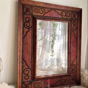Antique mirror designed by "Pierre Lottier". Leather and nails. France 1