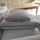 Three-seater grey mottled fabric sofa