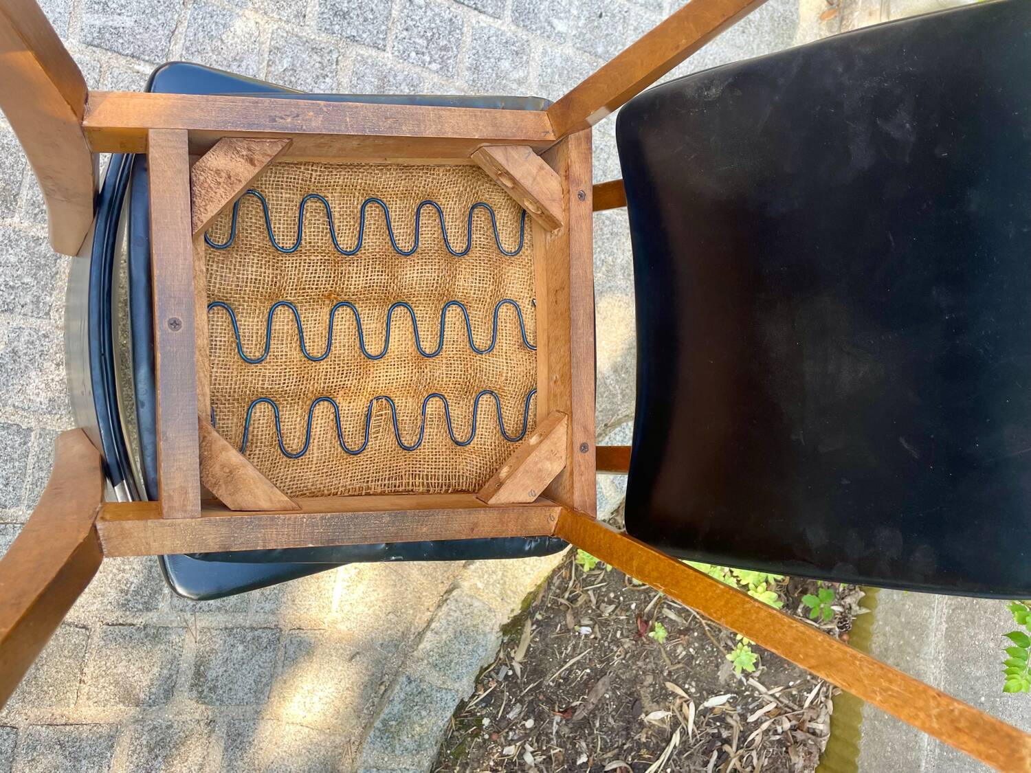 Two vintage Scandinavian chairs in beech and black leatherette