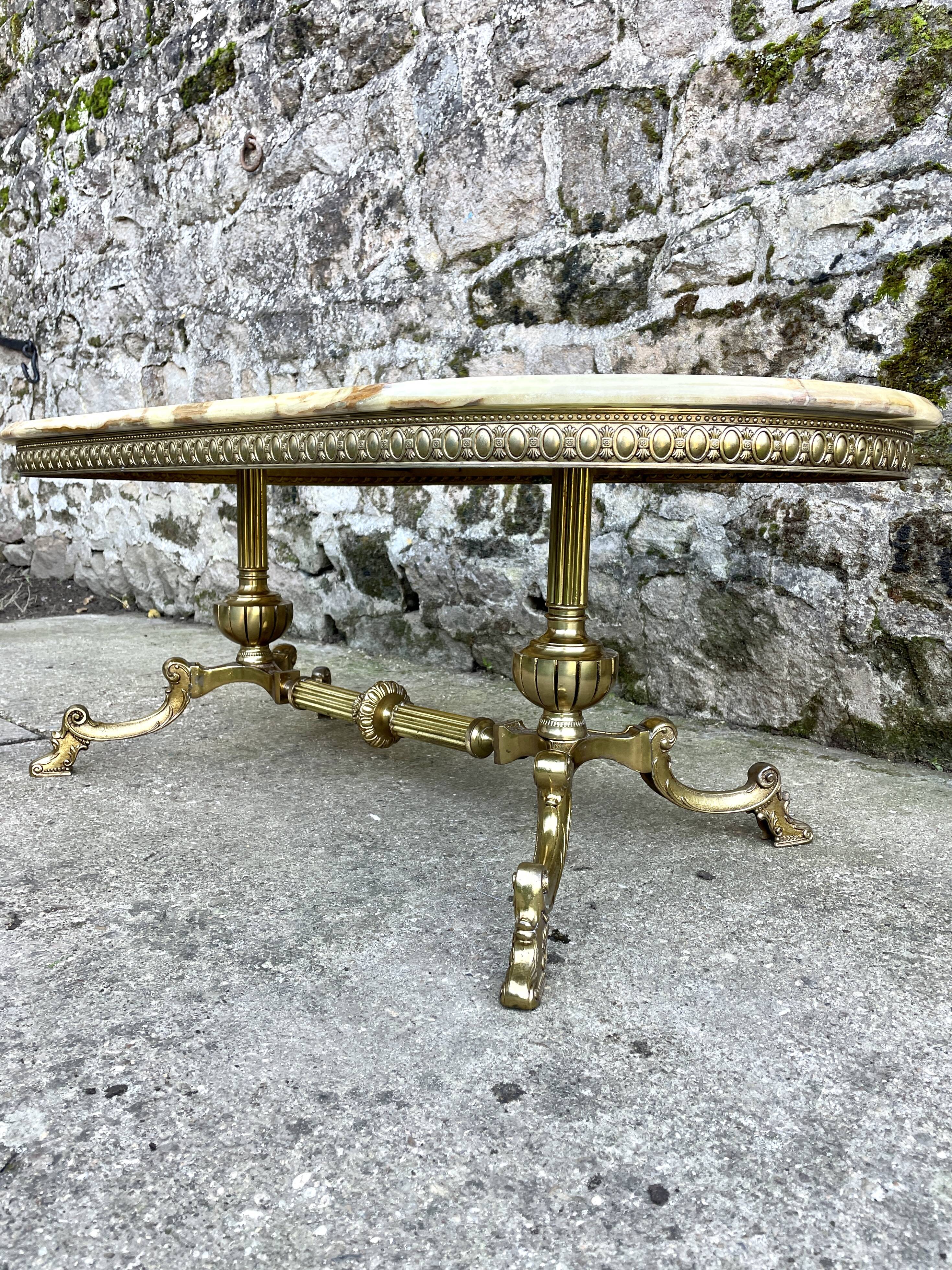 Louis XVI style oval coffee table in onyx and gilt brass