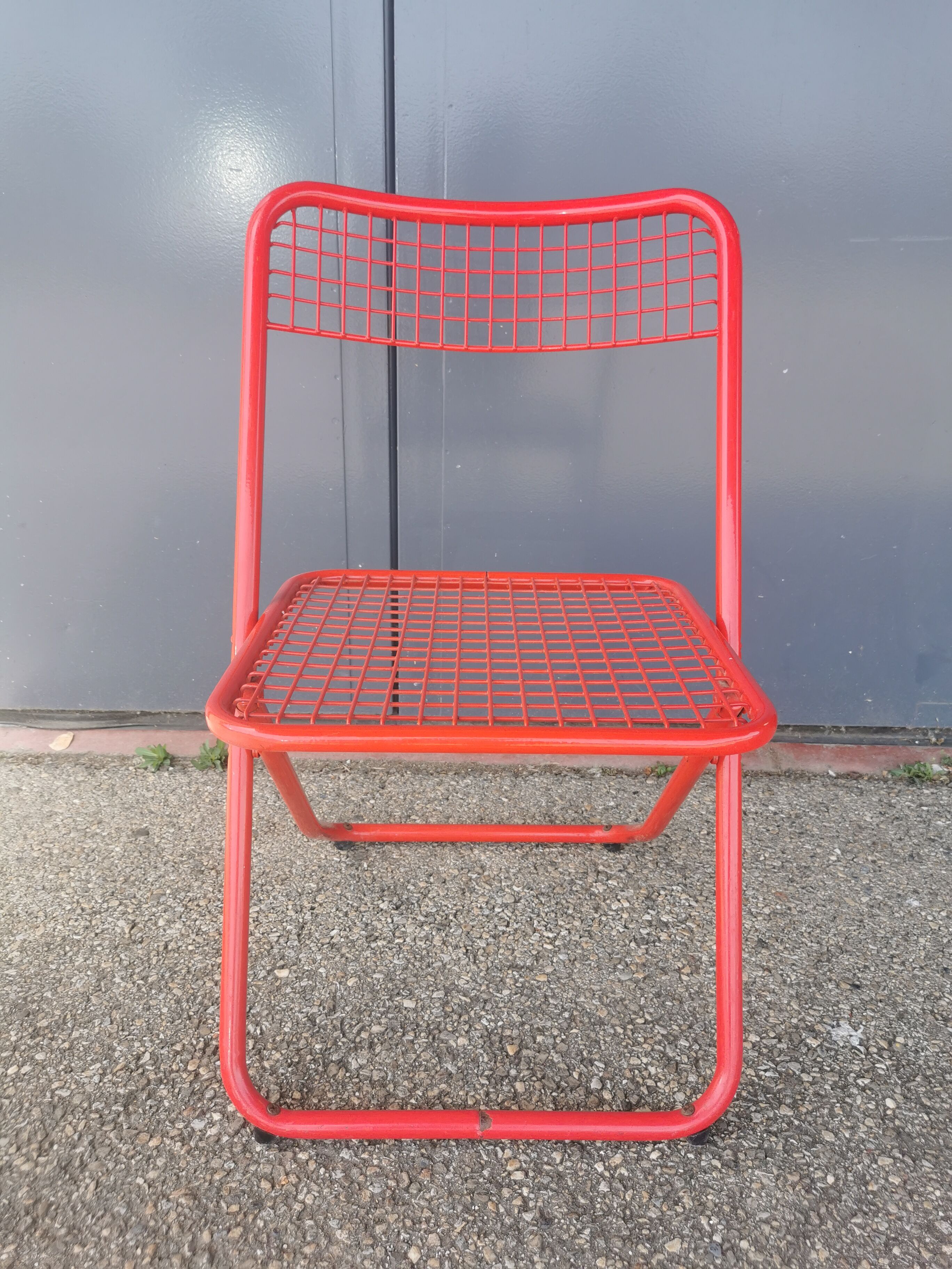 Vintage red metal folding chair