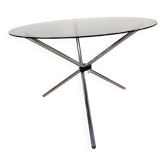 Vintage round table with smoked glass and foldable chrome legs.