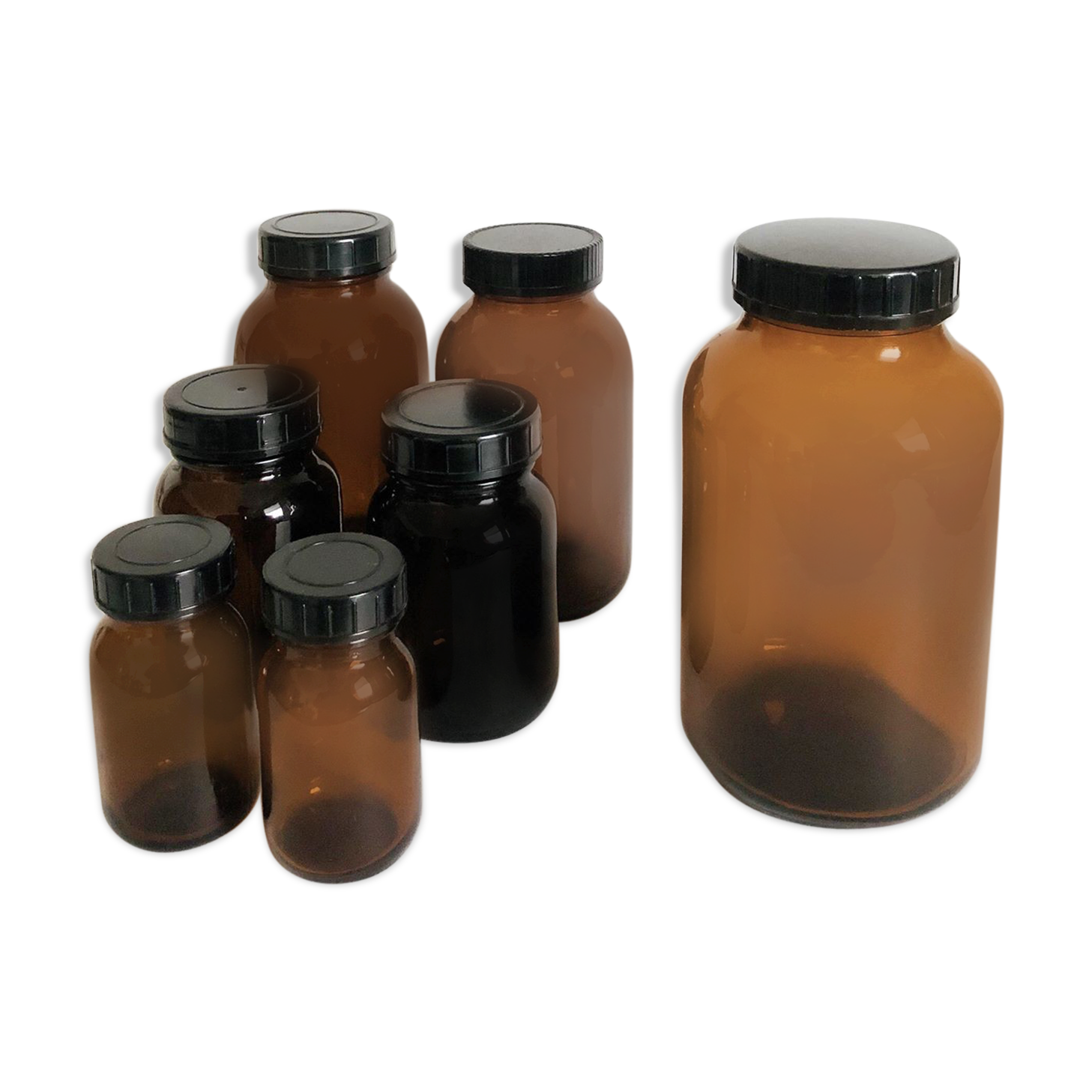 Lot of 7 bottles of amber glass apothecary style