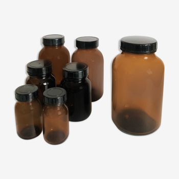 Lot of 7 bottles of amber glass apothecary style