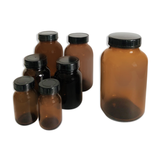 Lot of 7 bottles of amber glass apothecary style