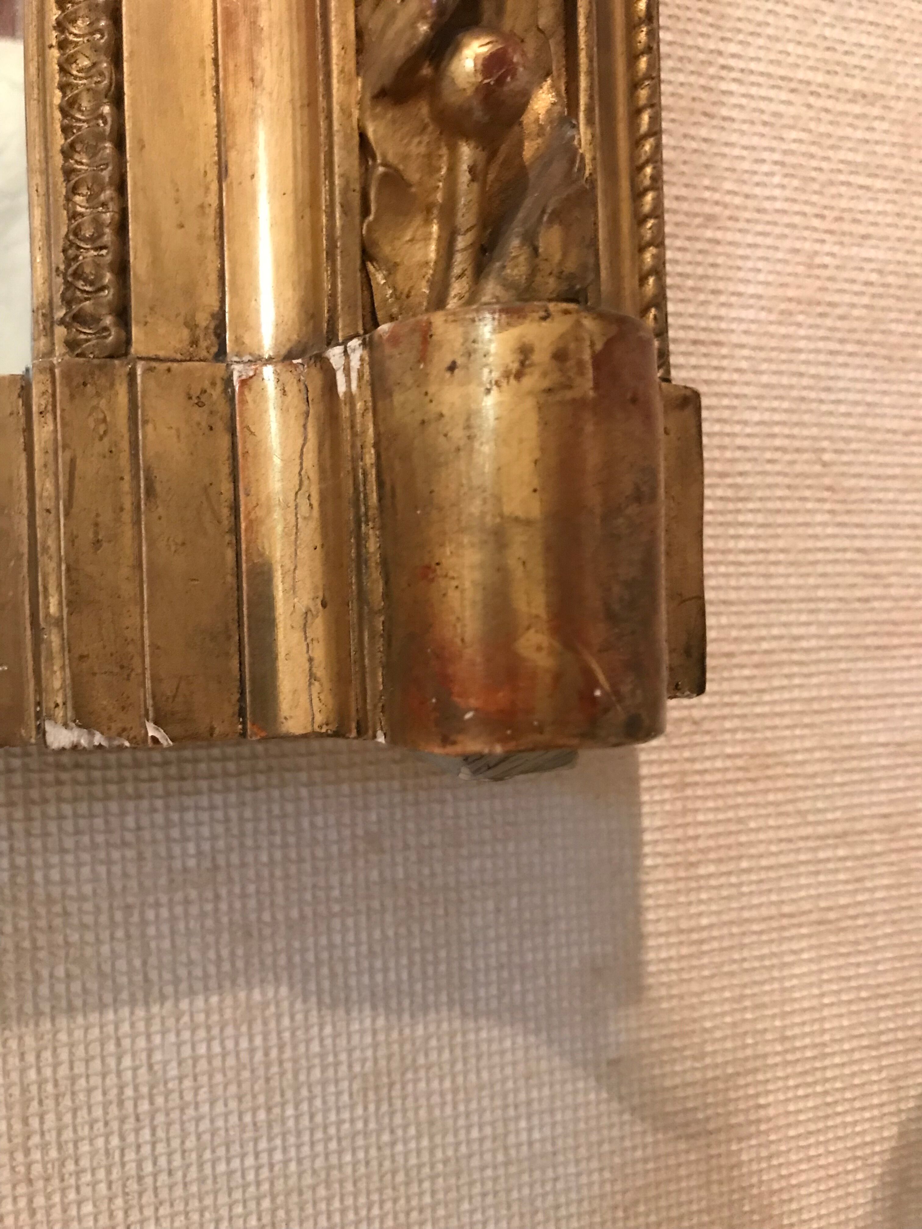 Large antique mirror with flagship shell in wood and gilded stucco