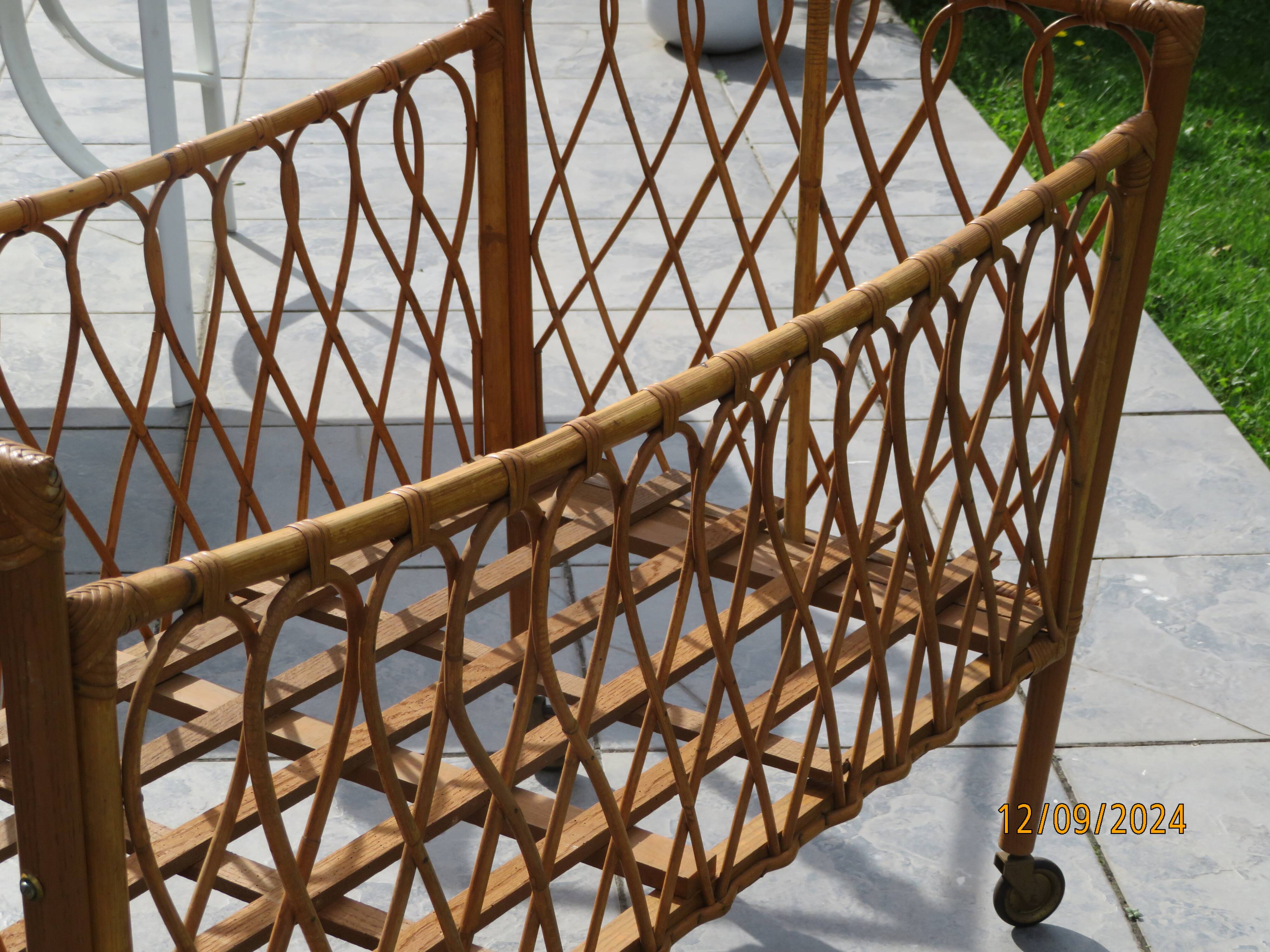 antique rattan children's bed with arrow