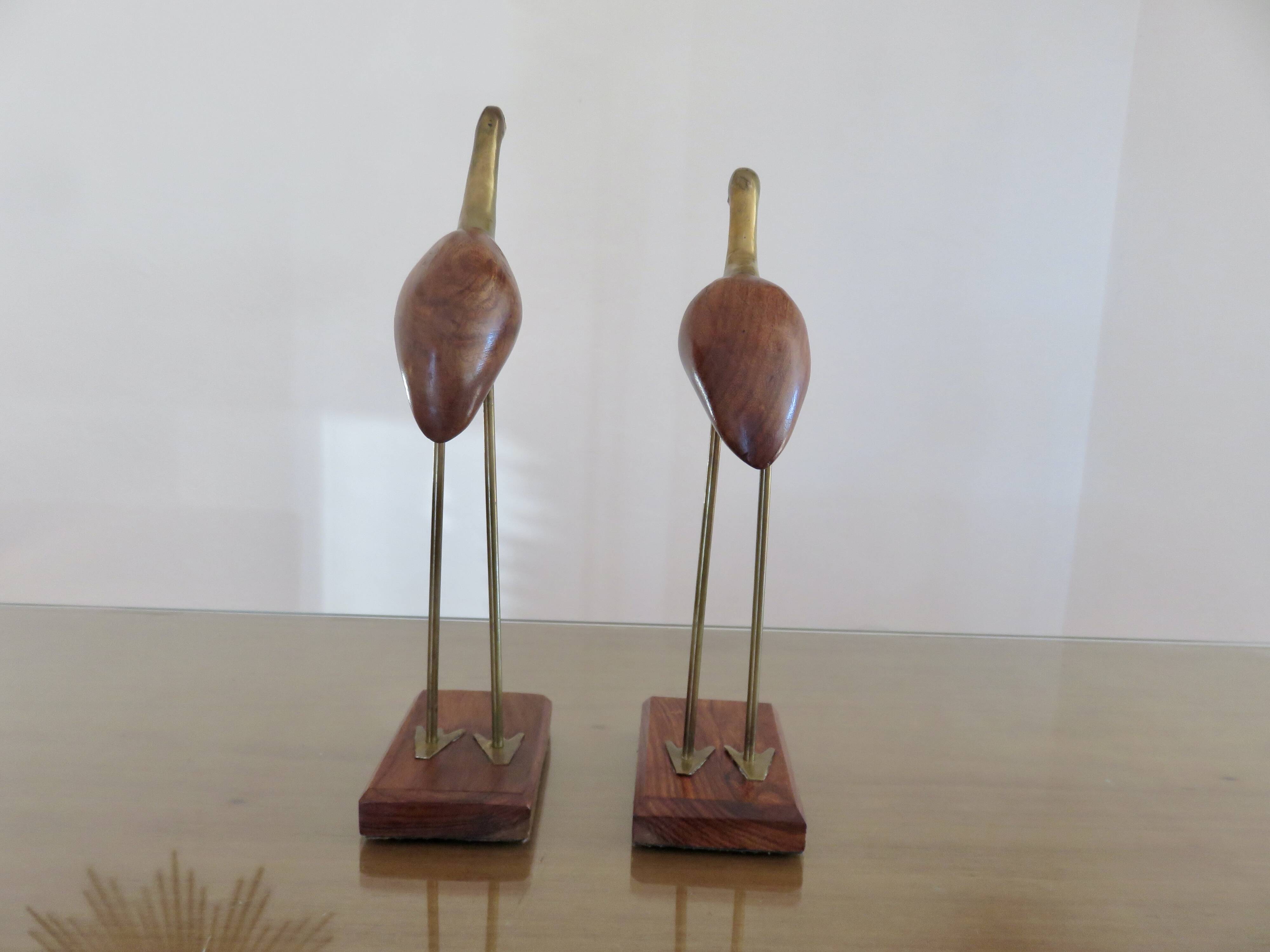 Pair of teak and brass herons from the 70s