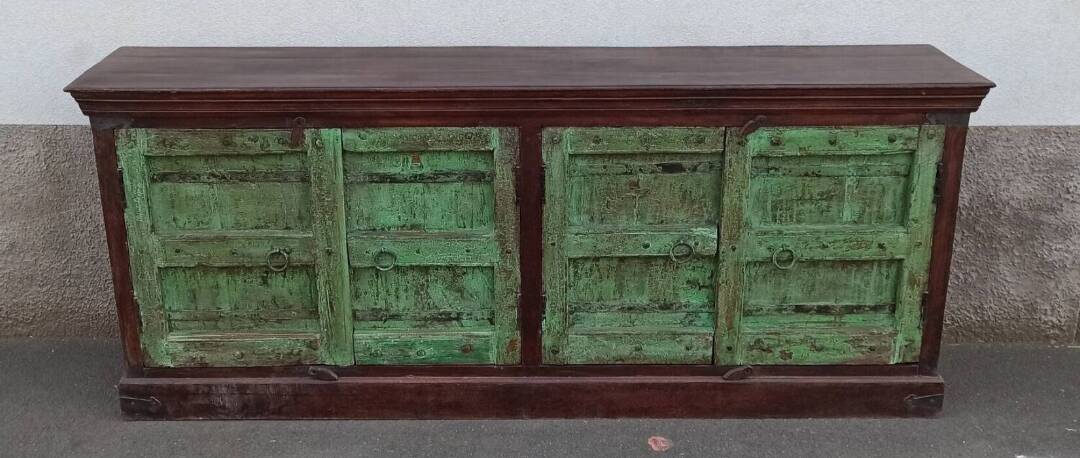 Long wooden sideboard with old green doors