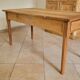 Old farmhouse table made of solid walnut wood.