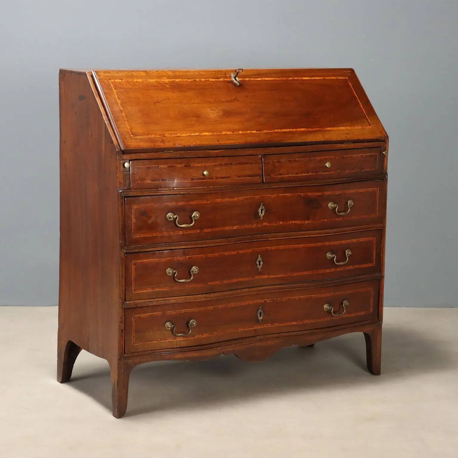 Antique drop-leaf cabinet in walnut with maple inlays, Italy, mid-18th century.