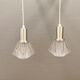 A set of smaller hanging lamps, in hard pressed glass, with metal top