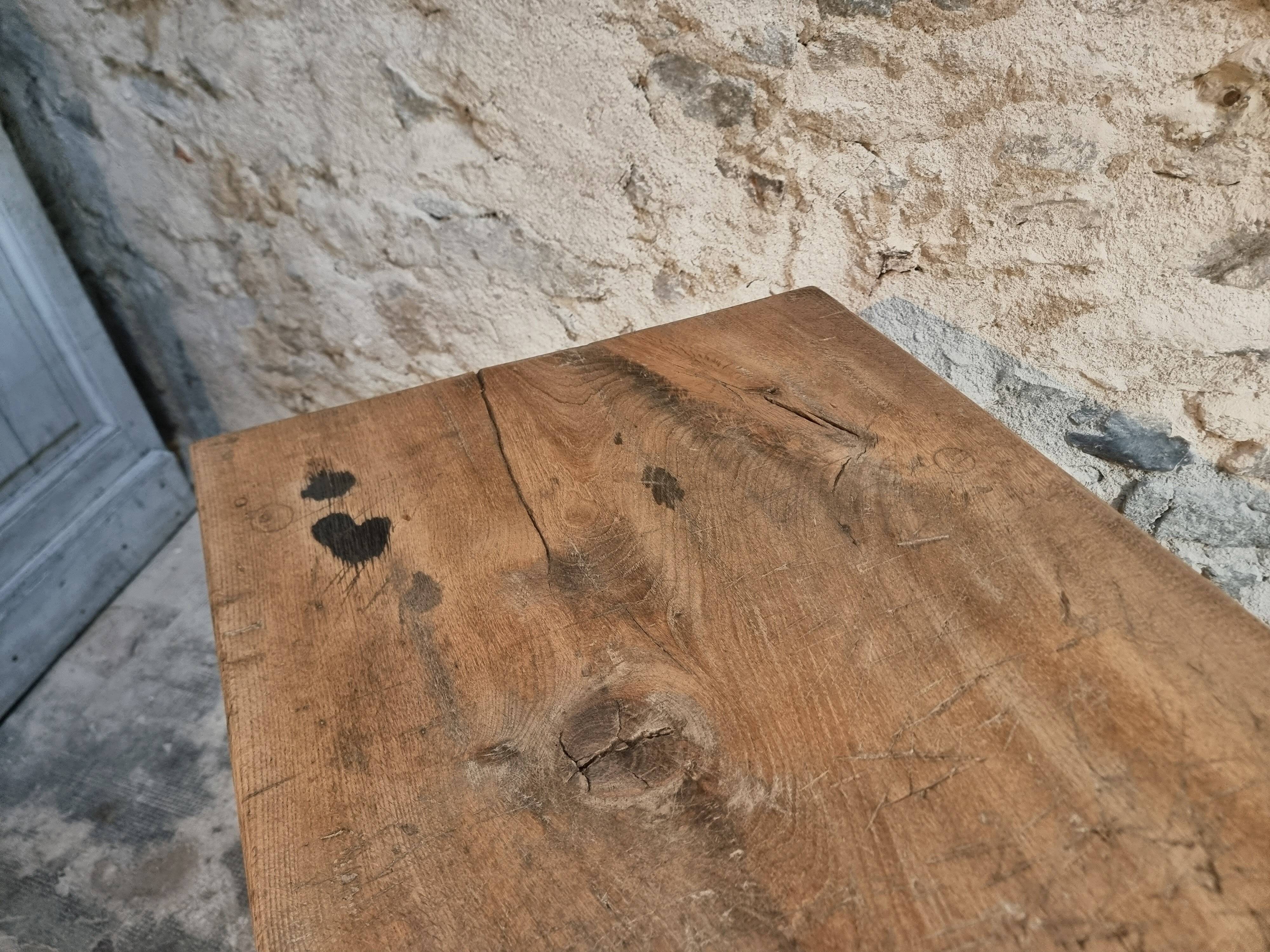 Antique work table / primitive dining table in oak, Hungary, circa 1900–1930.