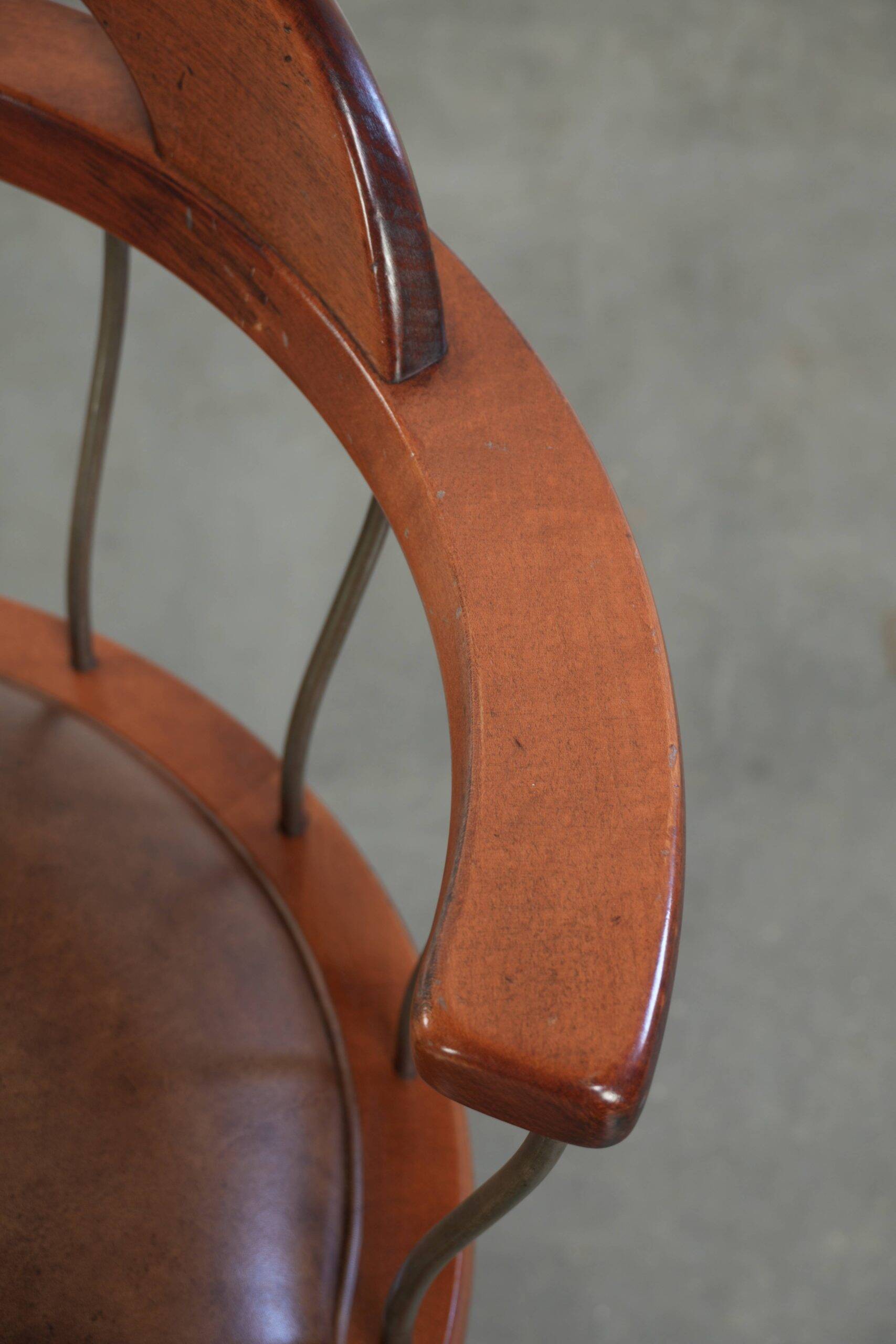 Swivel side chair / office chair with a cognac-coloured cow leather seat