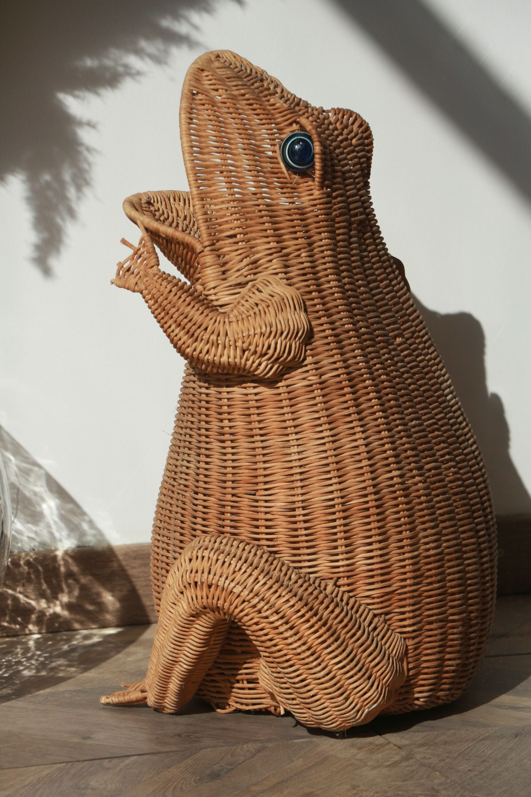 Wicker frog magazine rack by Olivier Cajan