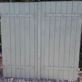 Pair of wooden shutters hanging iron