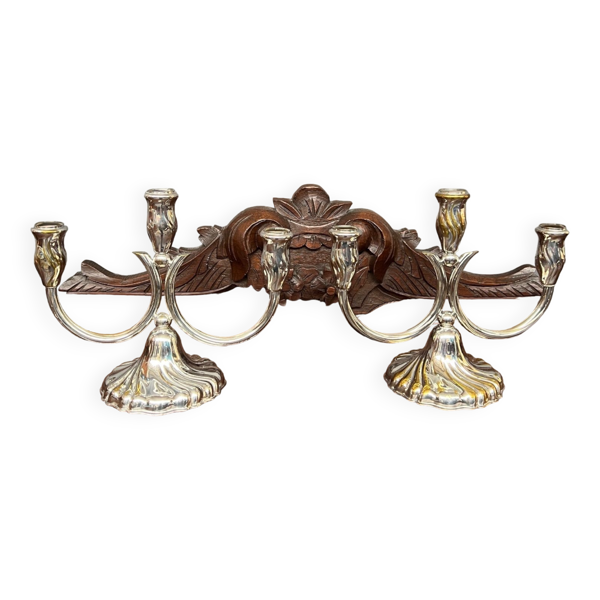 A pair of candlesticks. silver metal with gold decoration.