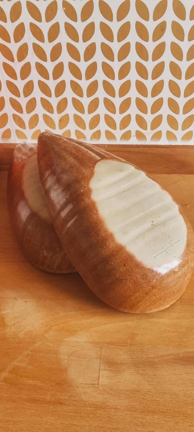 Glazed stoneware bowls for aperitifs or as catchalls in the shape of a walnut, signed.