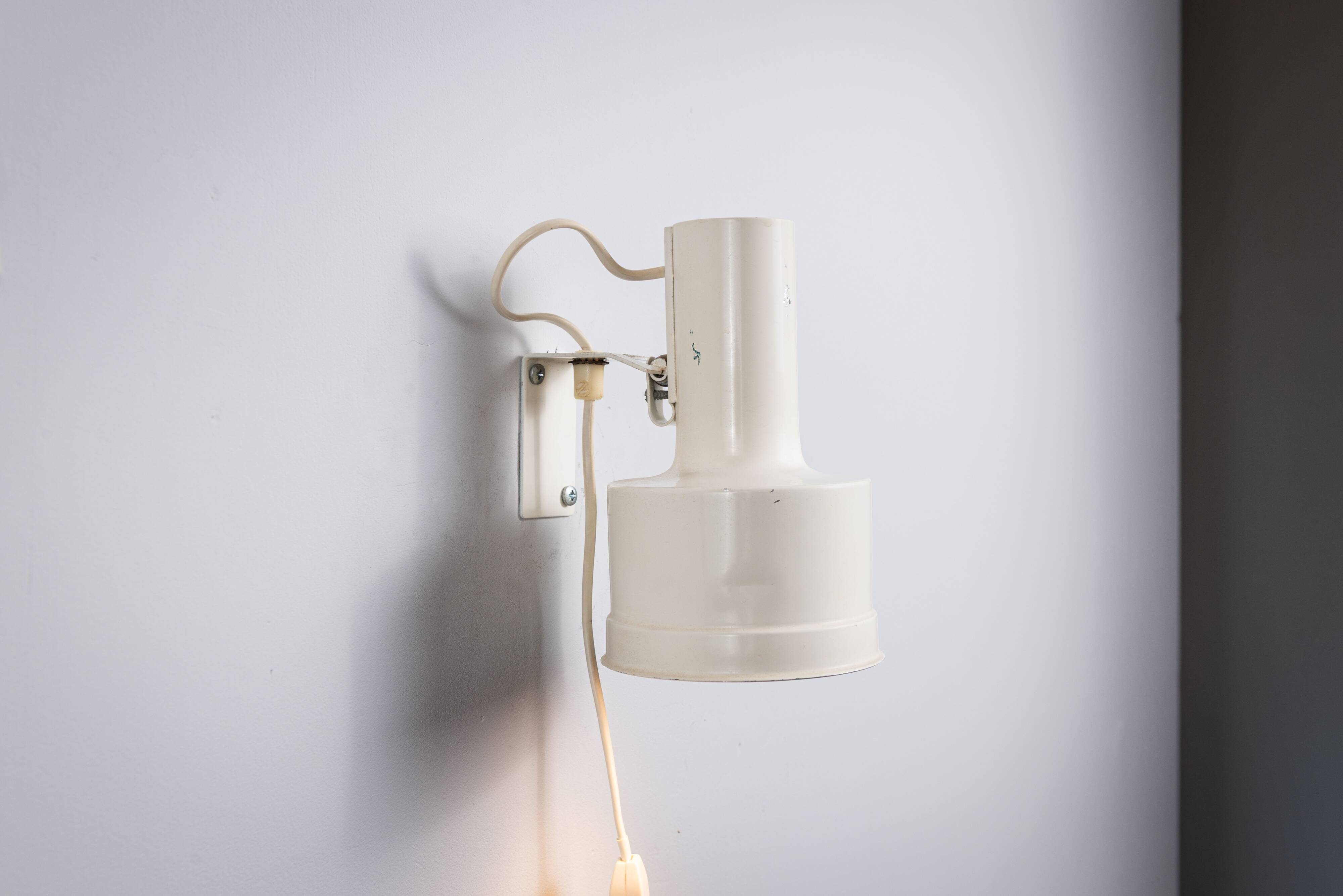 Pair of adjustable wall lamps designed by Per Sundstedt for Kosta Lampan