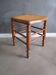 Tabouret ancien en bois et assise en cannage