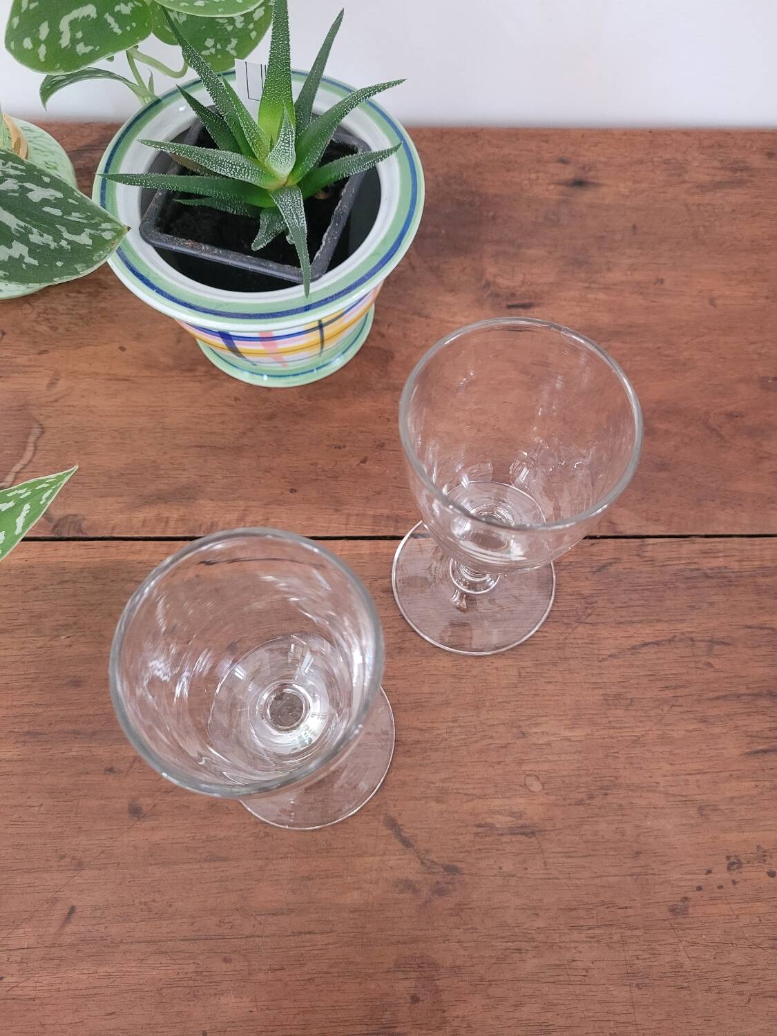 2 small stemmed glasses