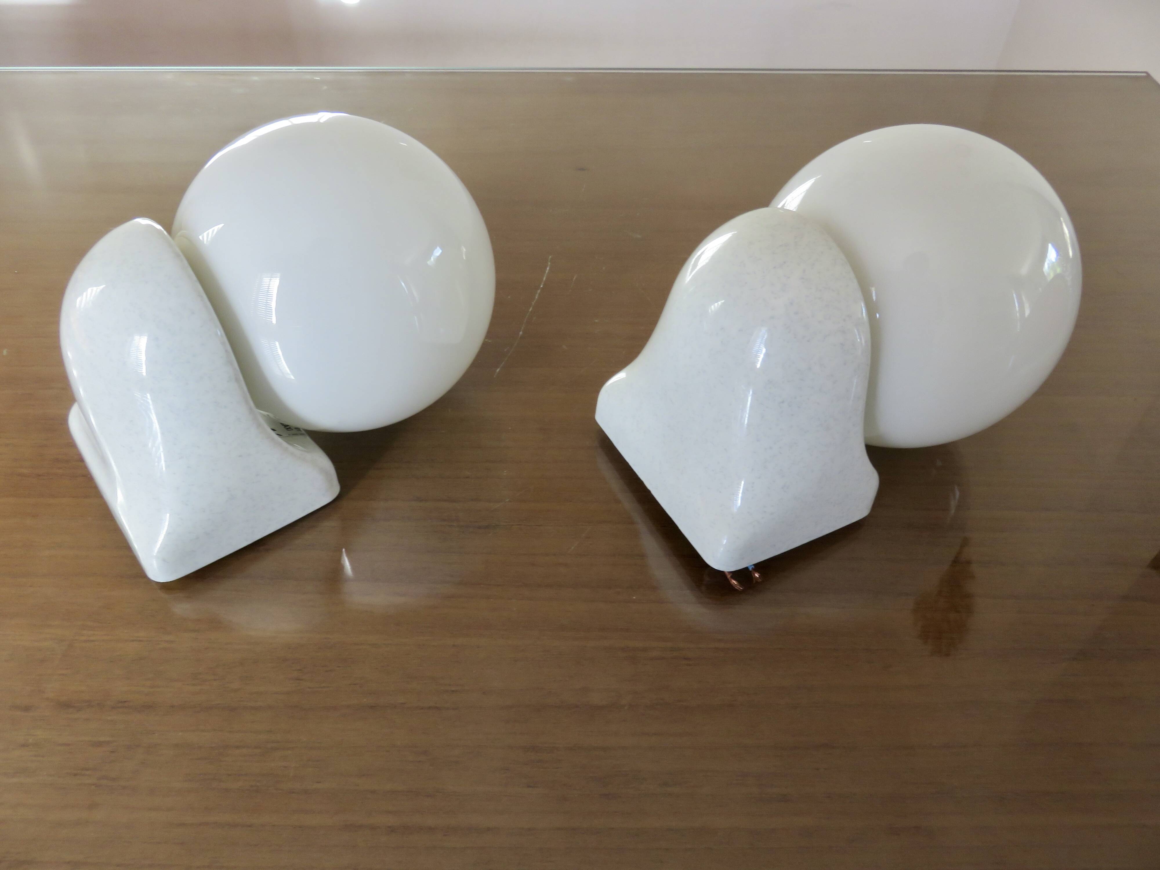 Pair of streamline opaline wall lights from the 80s
