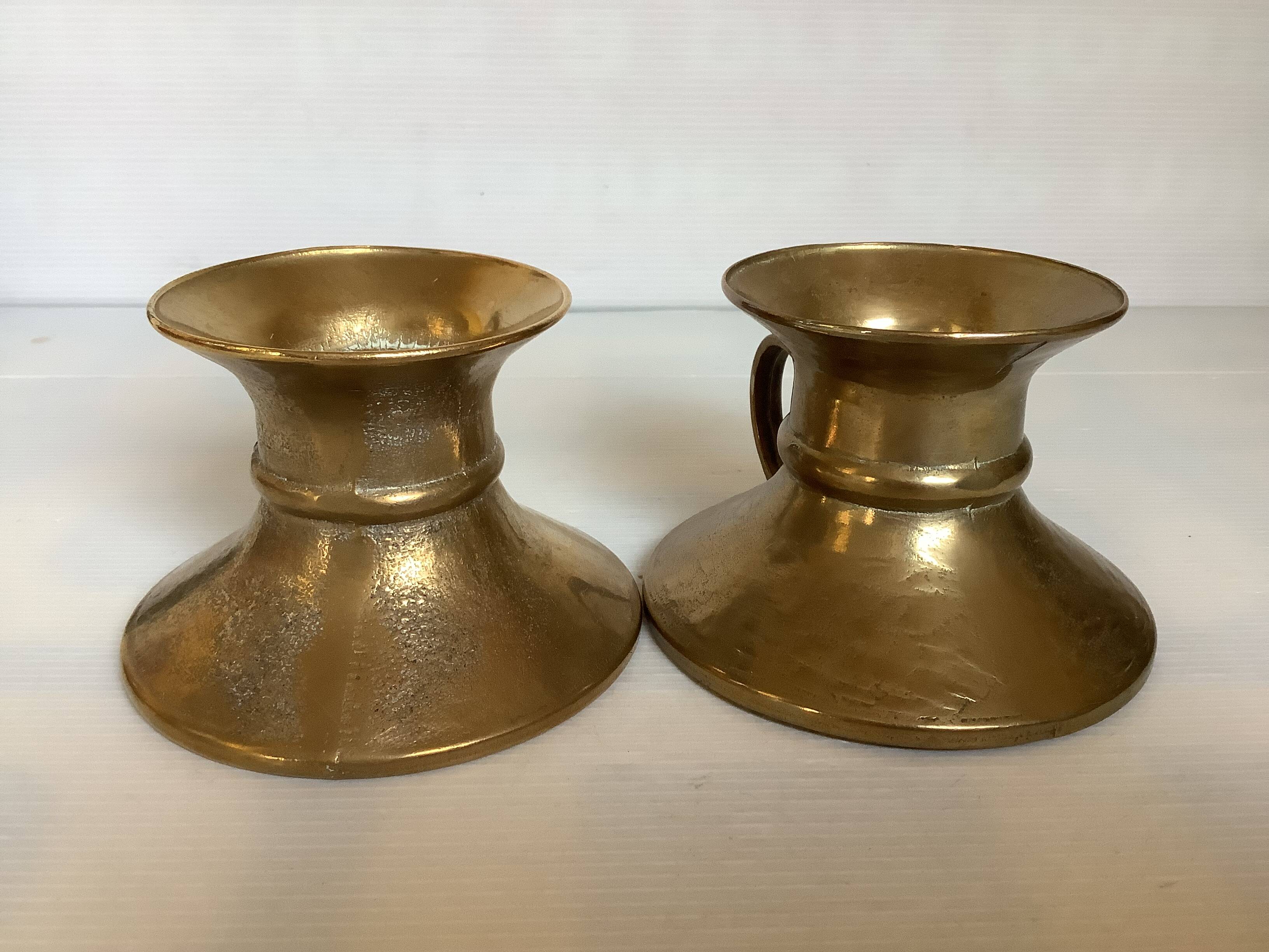 Pair of rat cave candlesticks with tulip base in bronze.