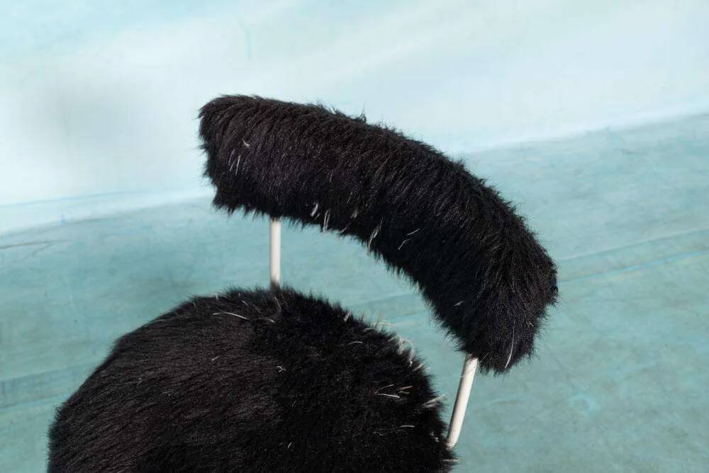 Space age design armchair from the sixties, fluffy stool with trumpet base.