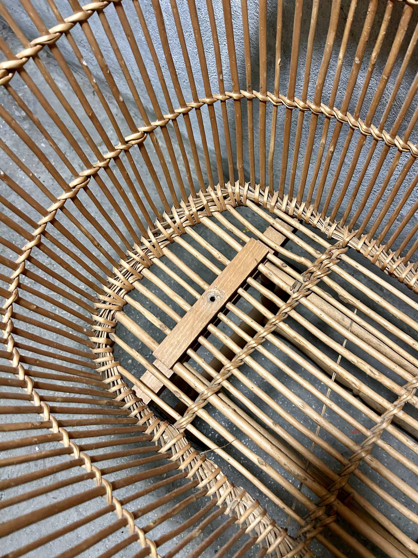 Vintage wicker cradle on wheels