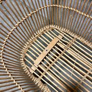 Vintage wicker cradle on wheels