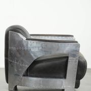 Cow leather aviator design armchair finished with aluminium and rivets