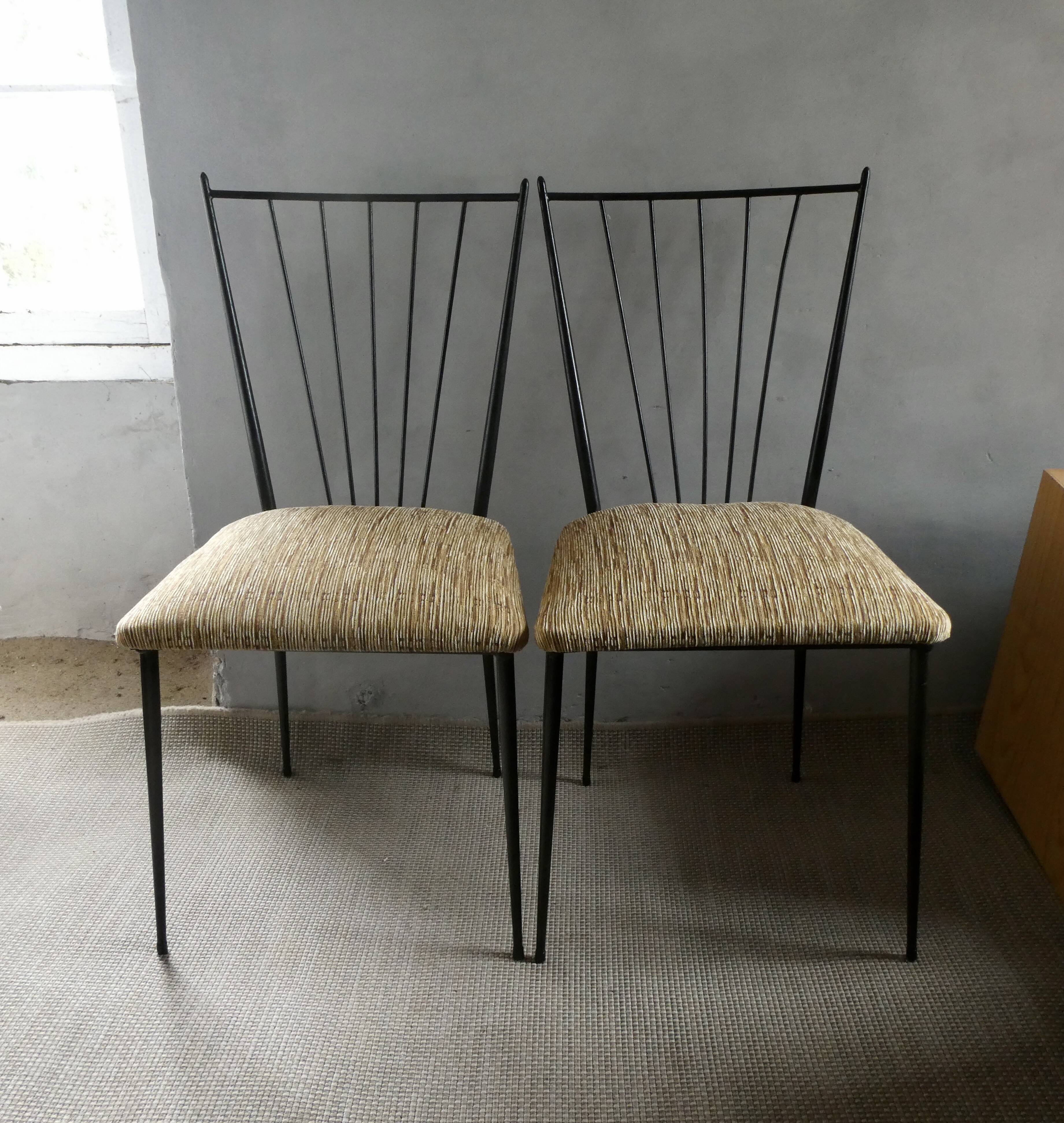 Pair of Colette Gueden chairs, black metal and fabric.