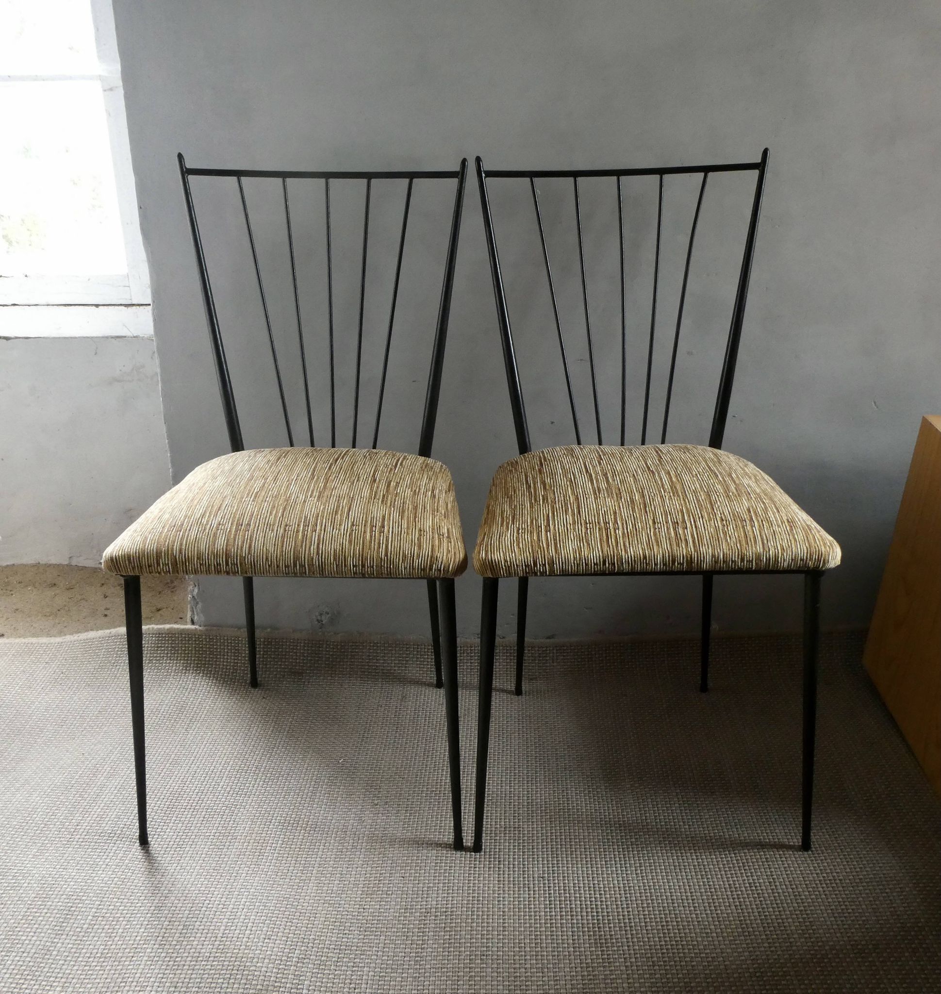 Pair of Colette Gueden chairs, black metal and fabric.