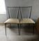 Pair of Colette Gueden chairs, black metal and fabric.