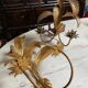 Pair of vintage golden palm leaf sconces