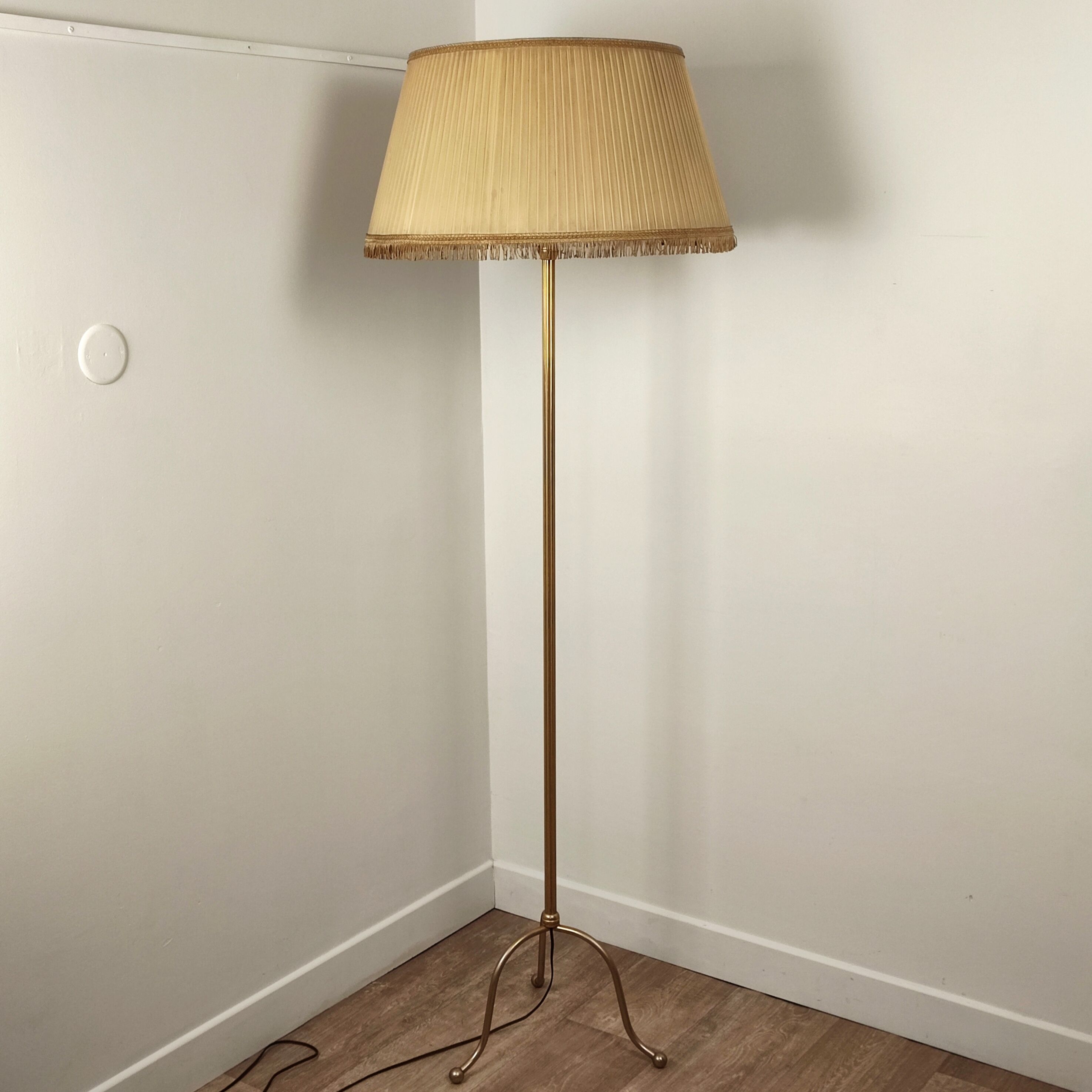 Golden tripod floor lamp