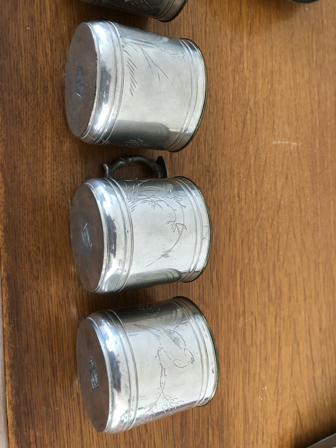 6 cups and sub-cups in pewter motifs birds and flowers and Chinese inscription