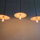 Trio of large industrial suspensions in green enamelled sheet metal.